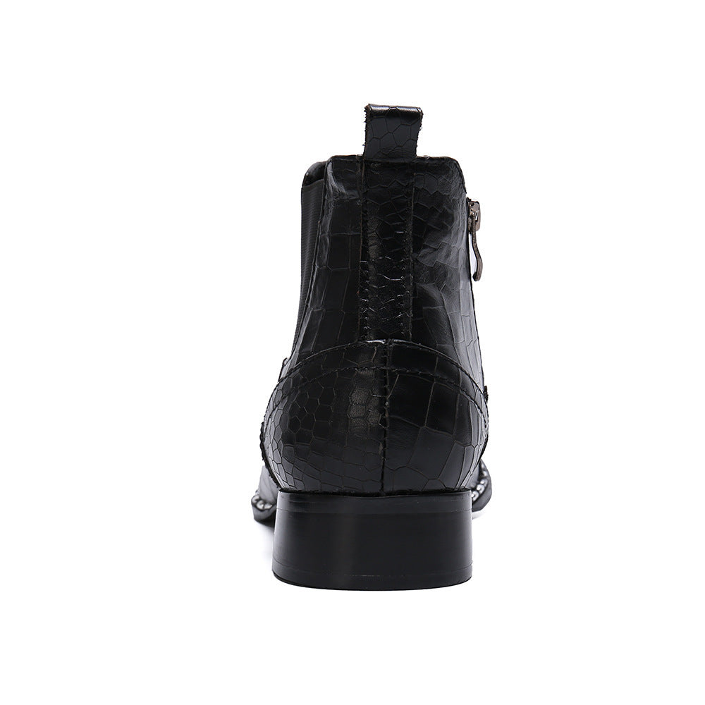 Black crocodile-patterned boot on a white background