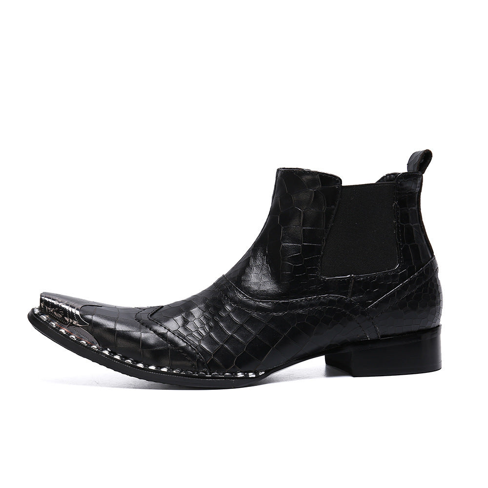 Black leather boot with crocodile texture on a white background