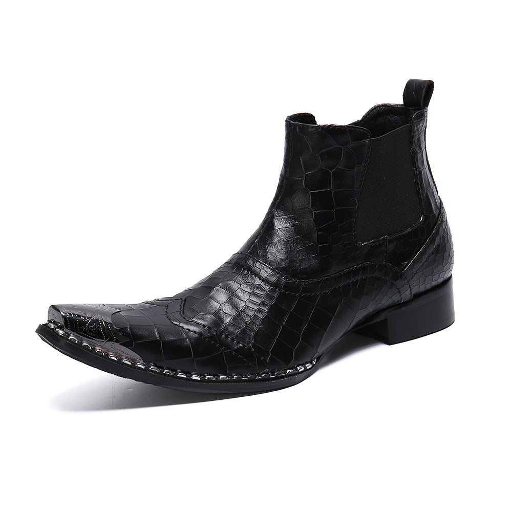 Black crocodile-patterned leather boot on a white background