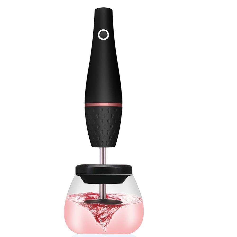 Black and pink wine aerator with liquid being aerated on a white background