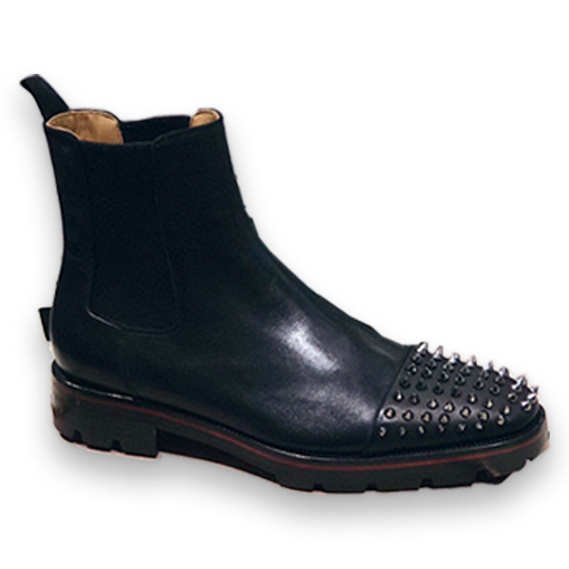 Black Chelsea boot with studded detail on a white background