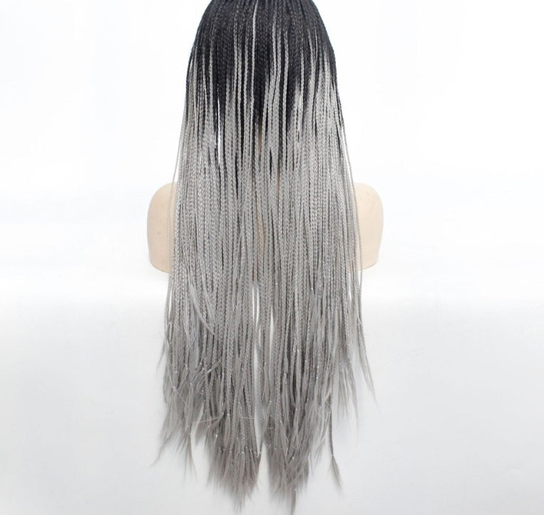 Mannequin head with black and gray ombre hair on a white background