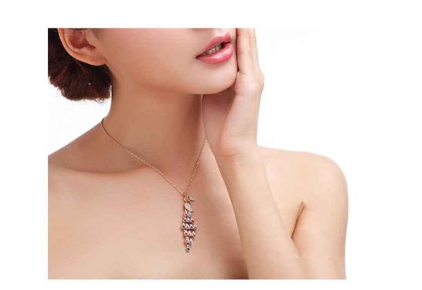 Woman wearing a delicate necklace with a white background