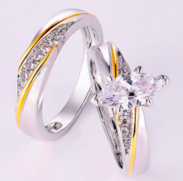 Two diamond rings on a light purple background