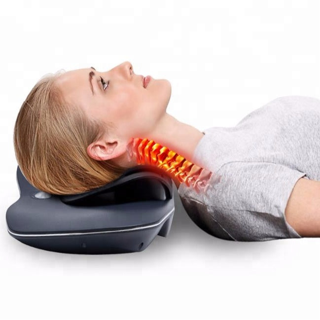 Person using a neck massager with an orange massaging pad on a white background