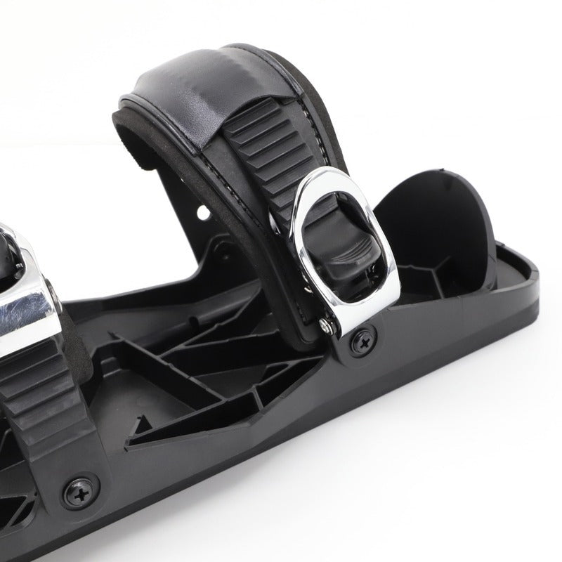 Close-up of a black snowboard binding on a white background