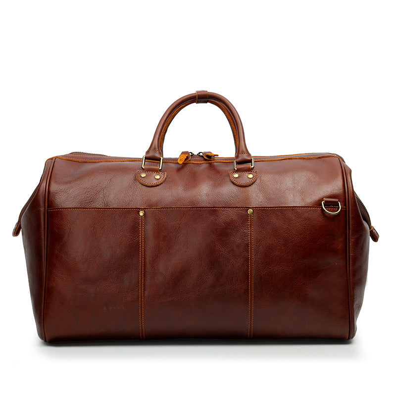 Brown leather duffel bag on a white background