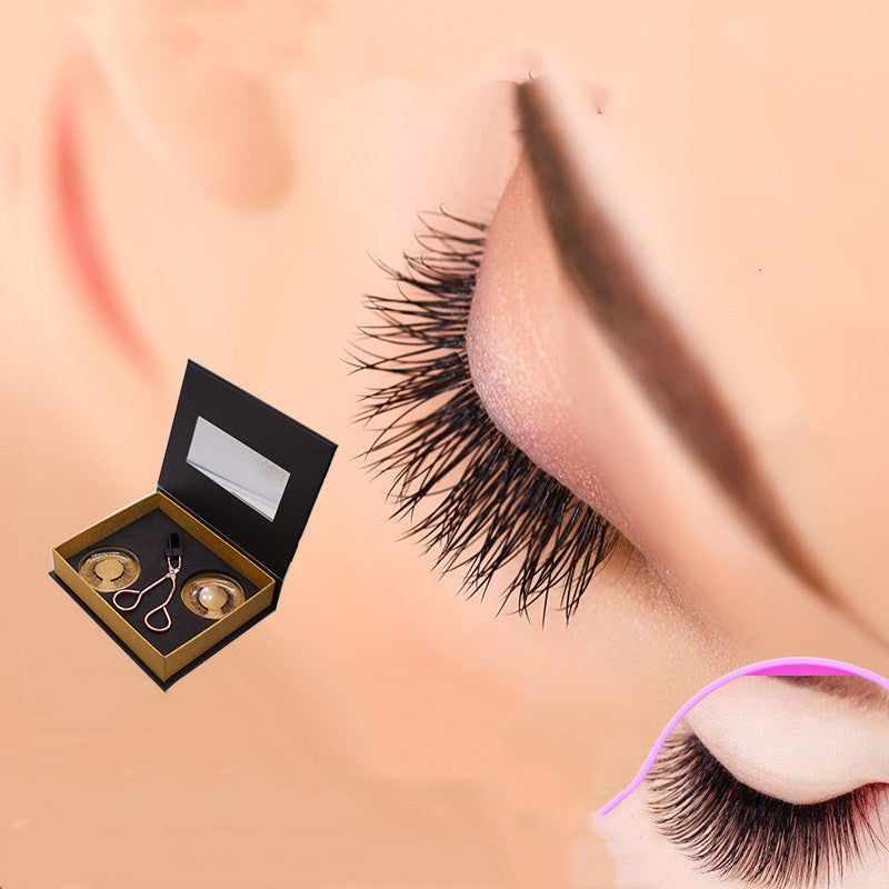 False eyelashes with applicator and storage case on a peach background