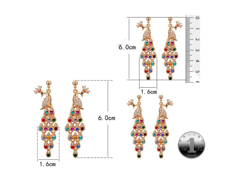 Colorful earrings with measurements on a white background