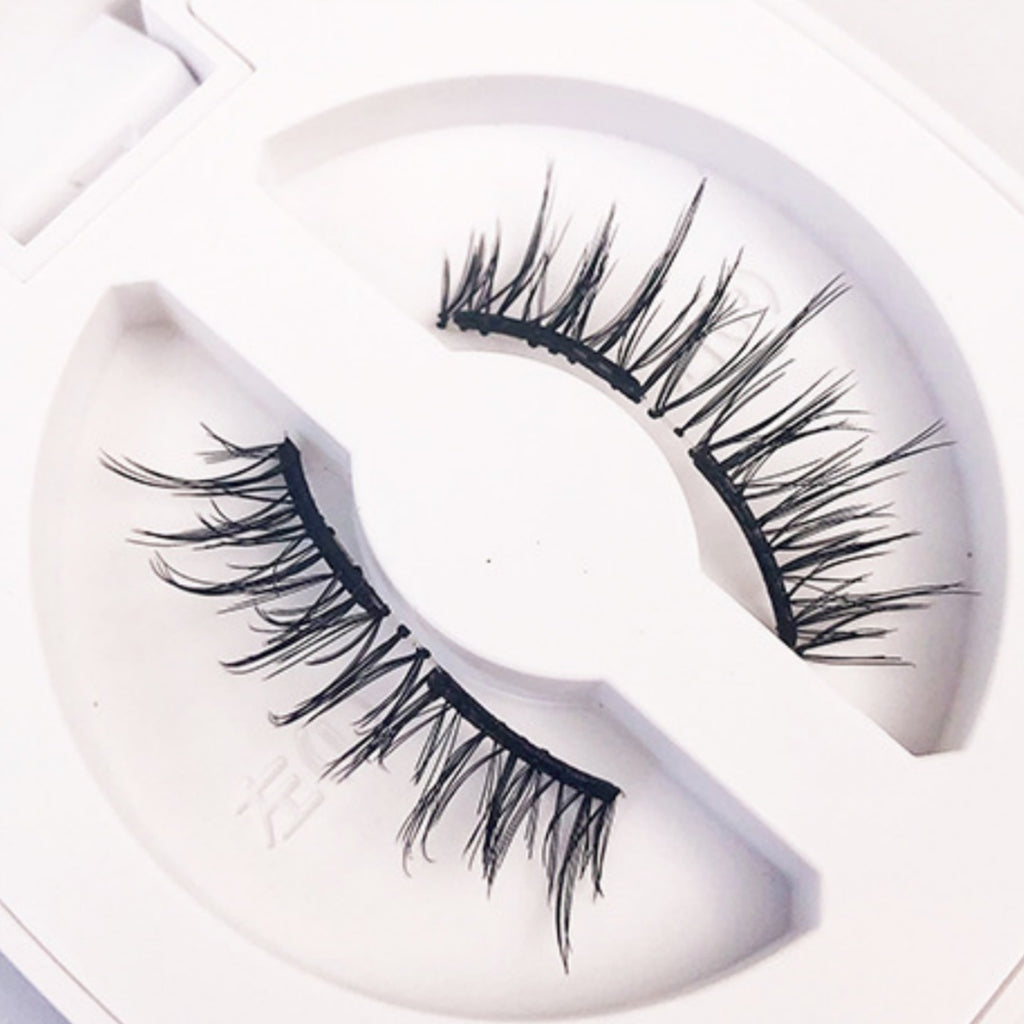 Pair of false eyelashes on a white background