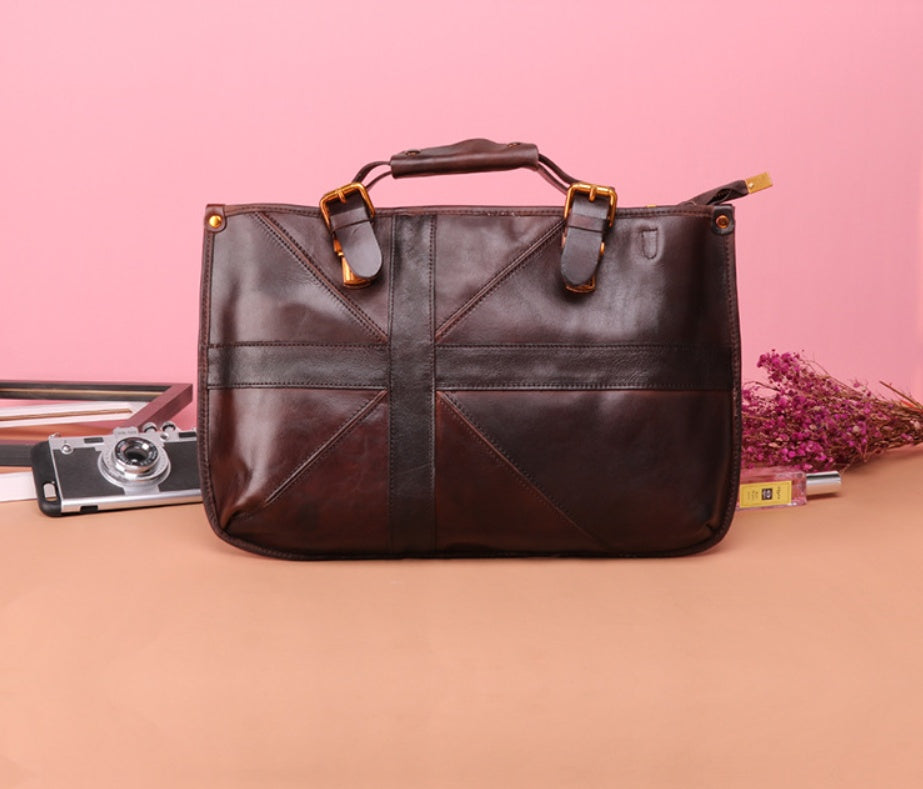 Brown leather bag on a pink and beige gradient background
