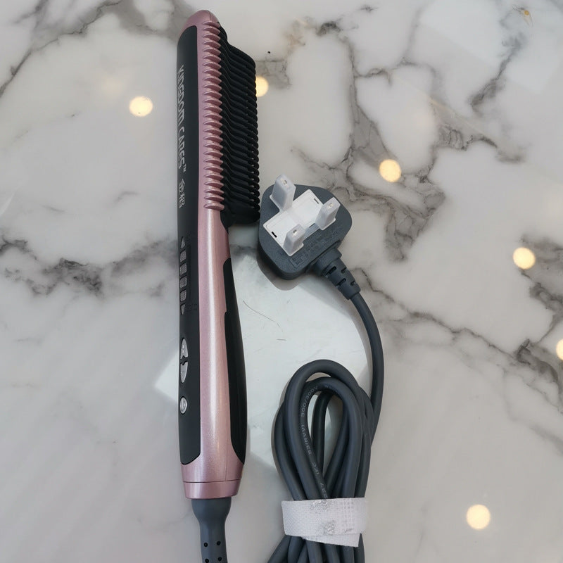 Hair straightener with plug and cord on a marble surface