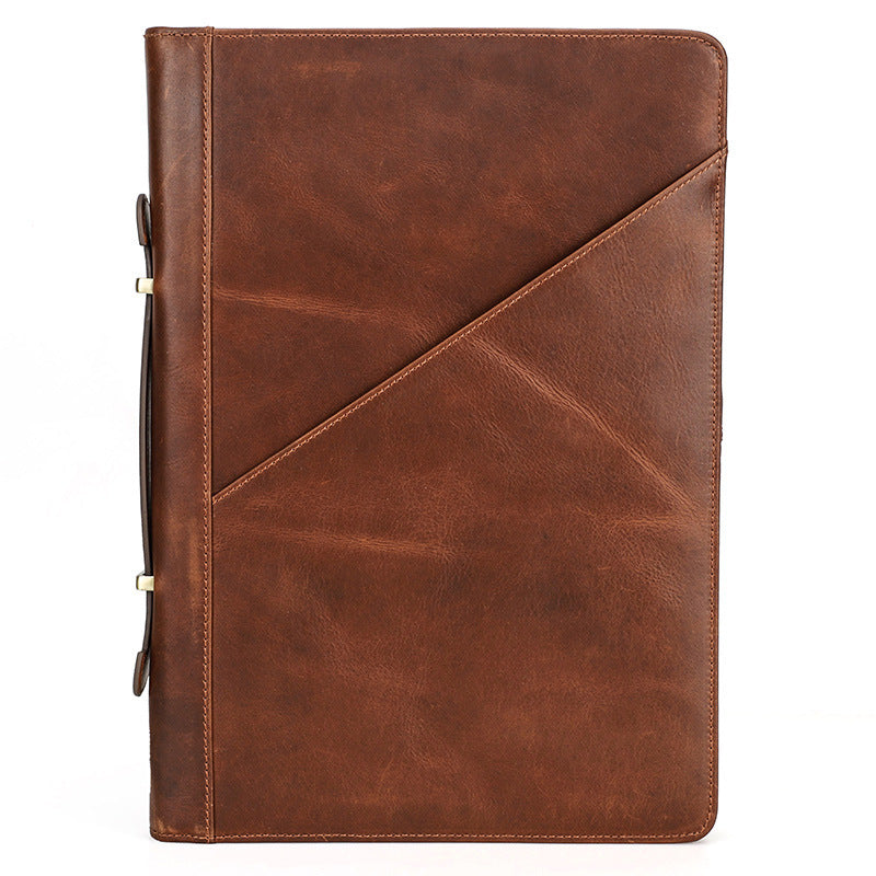 Brown leather notebook with geometric design on a white background