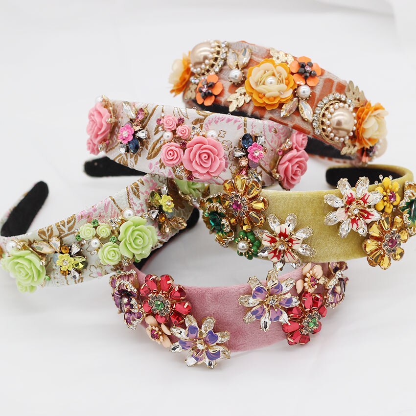 Colorful floral headbands with decorative elements on a white background