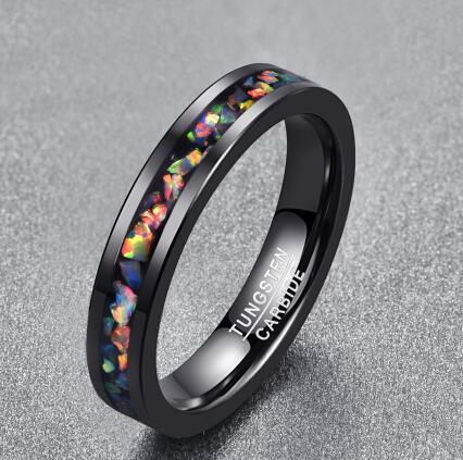 Black ring with colorful inlay on a gray background