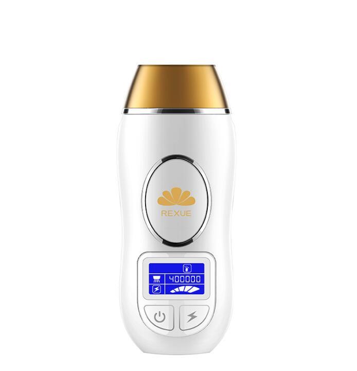 White and gold electronic device with digital display on a white background