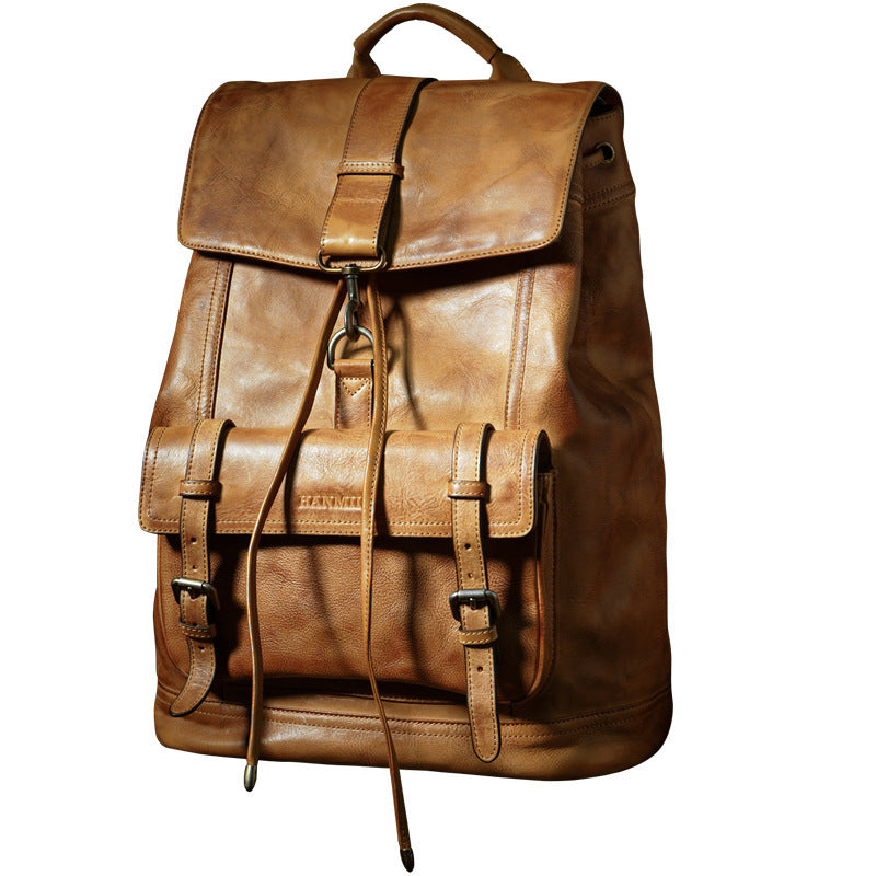 Brown leather backpack on a white background