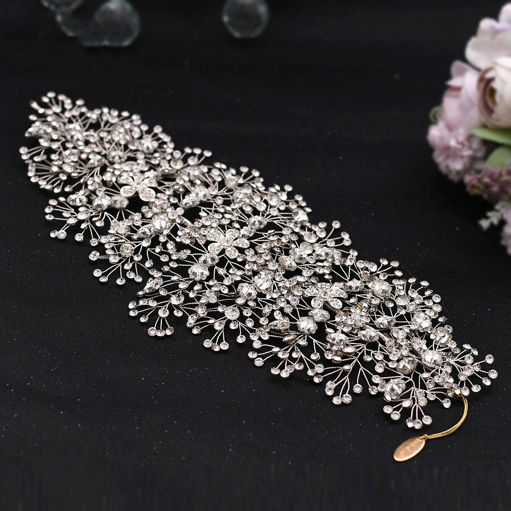 Silver hair vine with beads on a black background