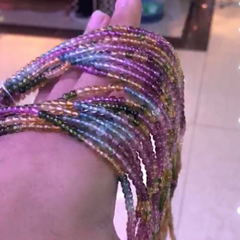 Multicolored beaded bracelet on a wrist with a blurred background