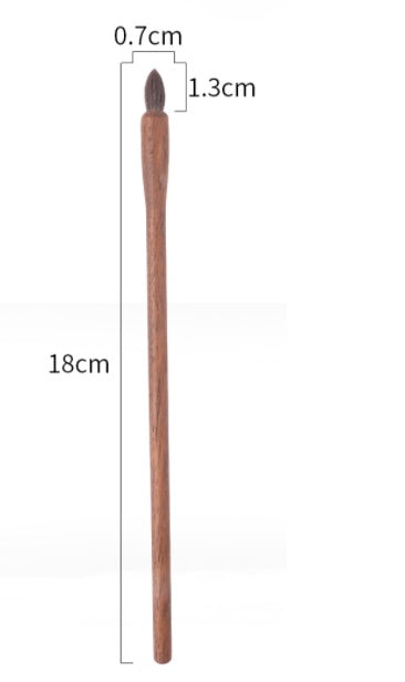 Wooden tool with measurements on a white background