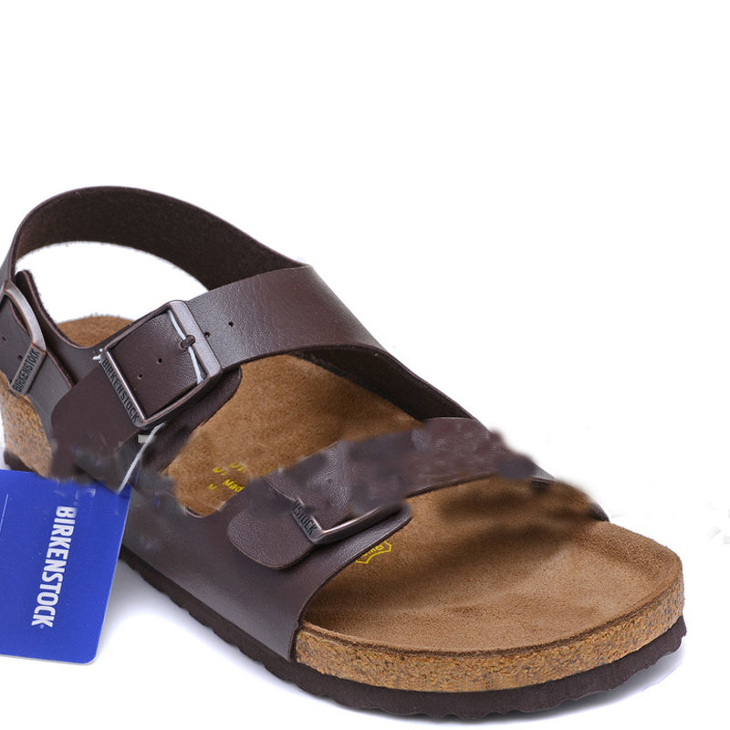Brown sandal with a Birkenstock tag on a white background