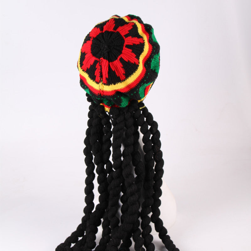 Colorful knitted hat with braided black yarn on a white background