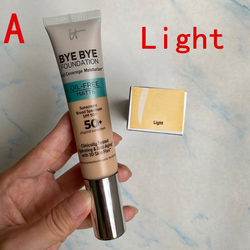It Cosmetics Bye Bye Foundation tube with a swatch labeled 'Light' on a textured background