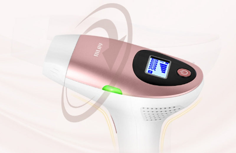 Pink and white electronic device with digital display on a light pink background