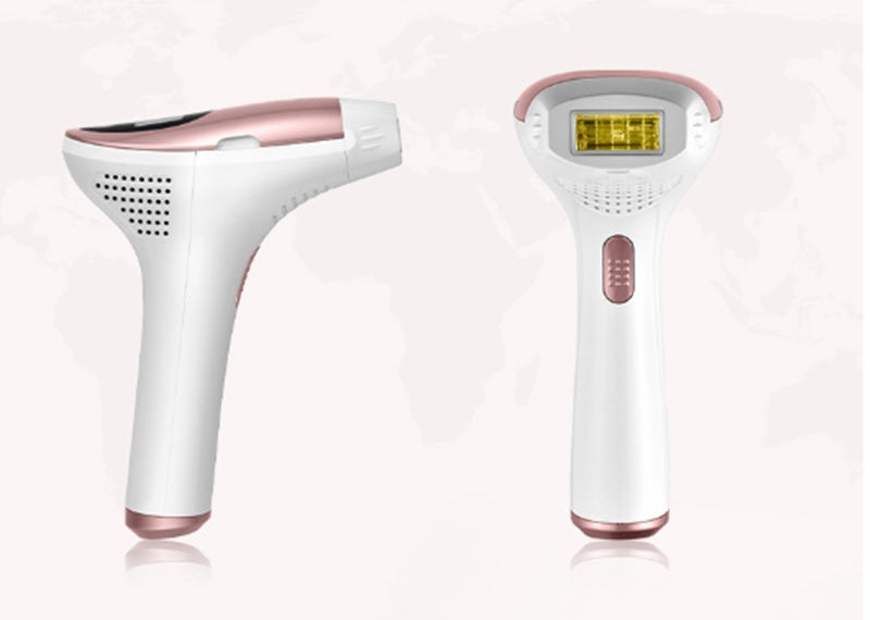 White and rose gold hair removal device on a white background