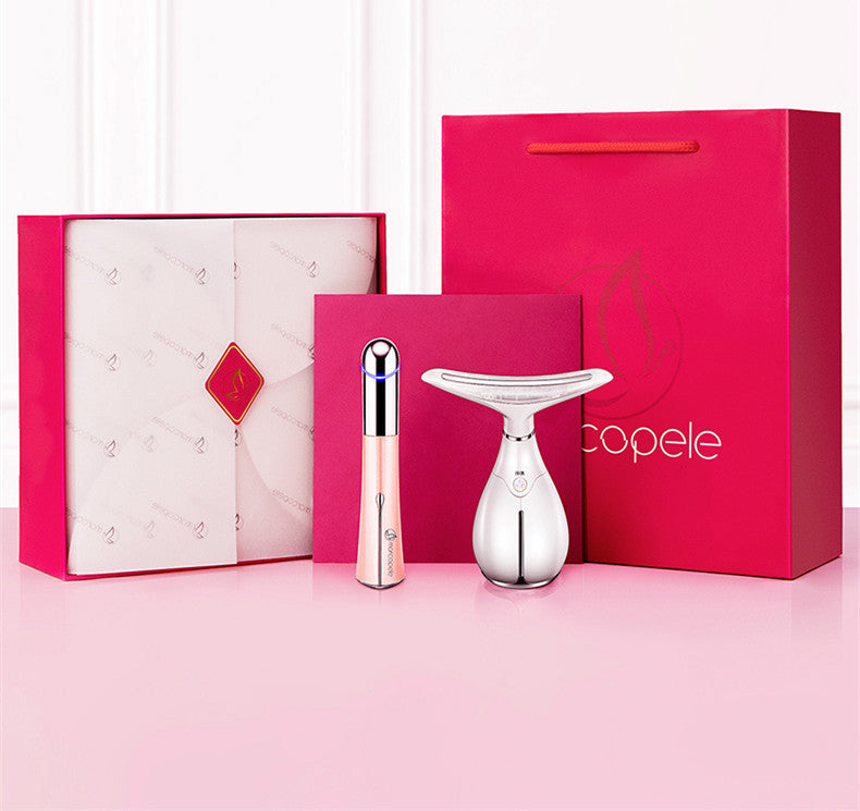 Beauty device with packaging and accessories on a pink background