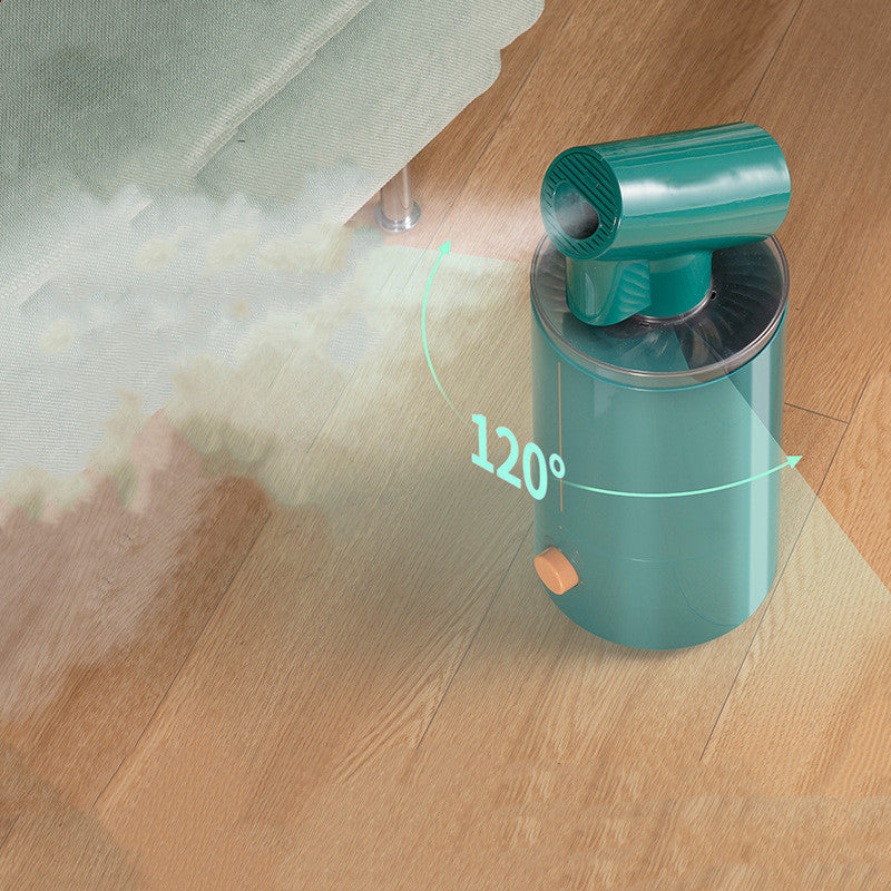 Green handheld device emitting steam on a wooden floor with '120°' displayed.