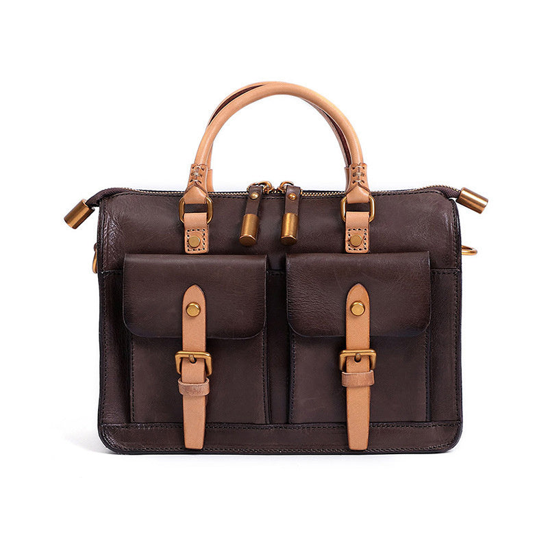 Brown leather bag with tan straps and buckles on a white background