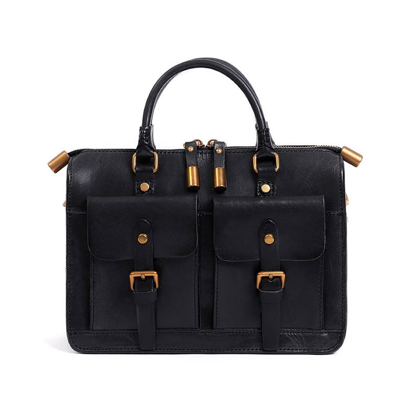 Black leather handbag with gold accents on a white background
