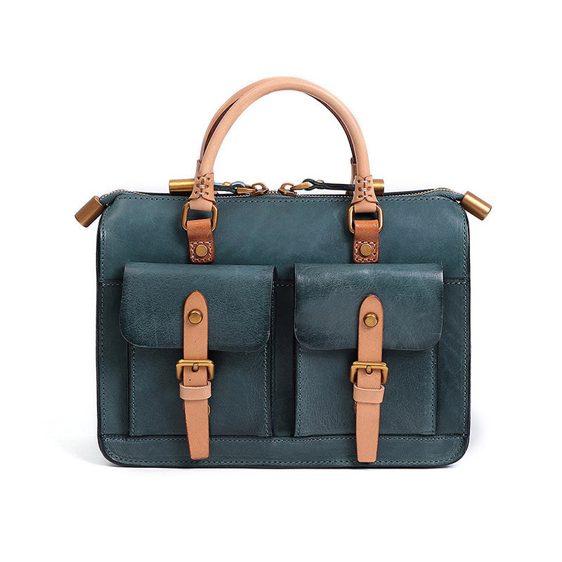 Green leather bag with brown straps on a white background