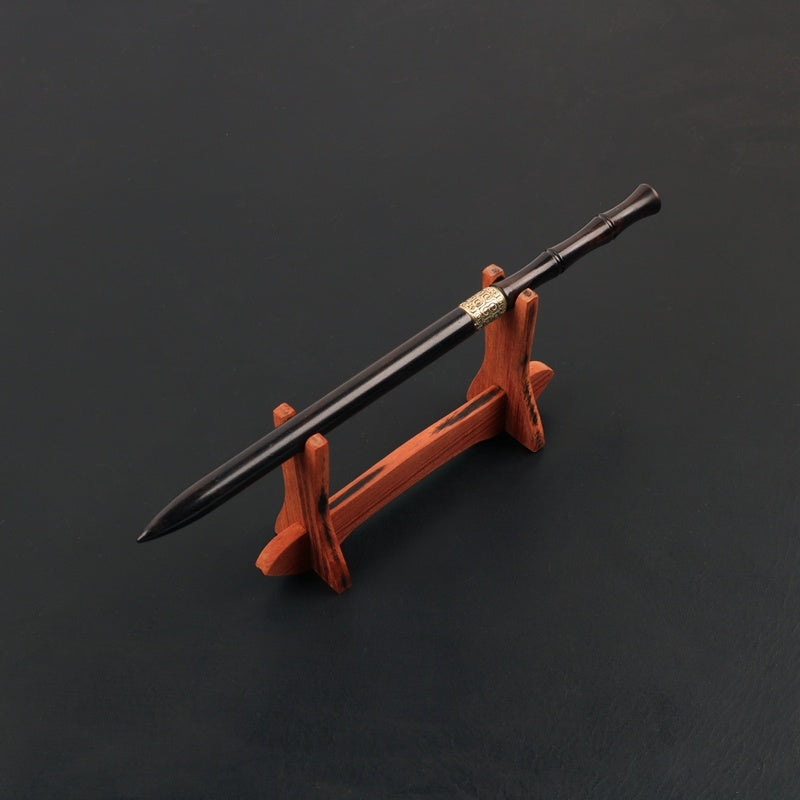 Sword on a wooden stand against a dark background