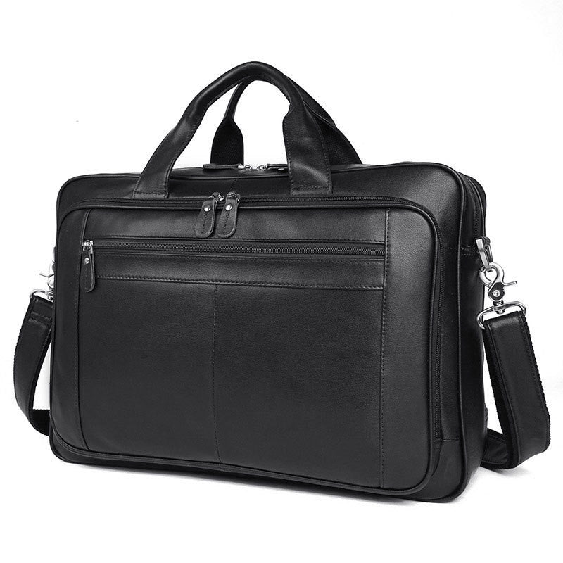 Black leather briefcase with shoulder strap on a white background