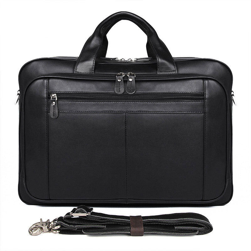 Black leather briefcase with shoulder strap on a white background