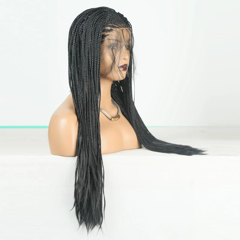 Black braided wig on a mannequin head against a white background