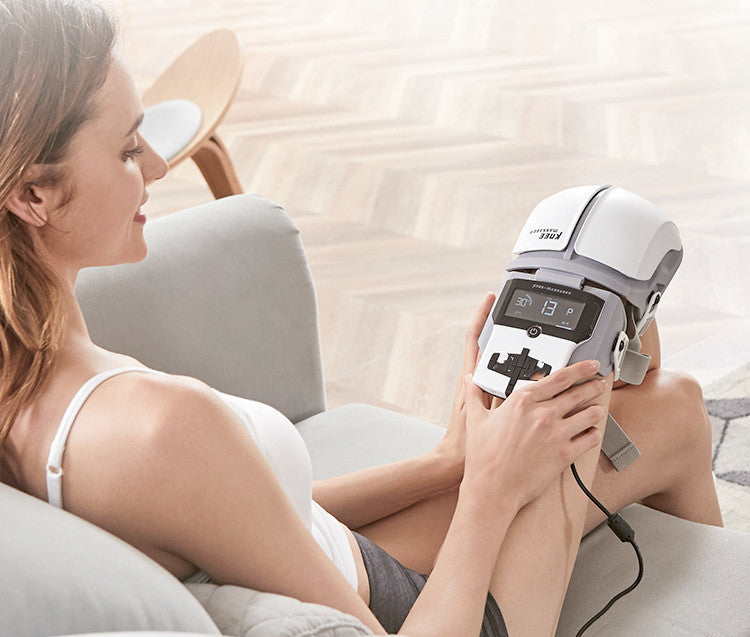 Woman using a handheld electronic device on her arm in a home setting