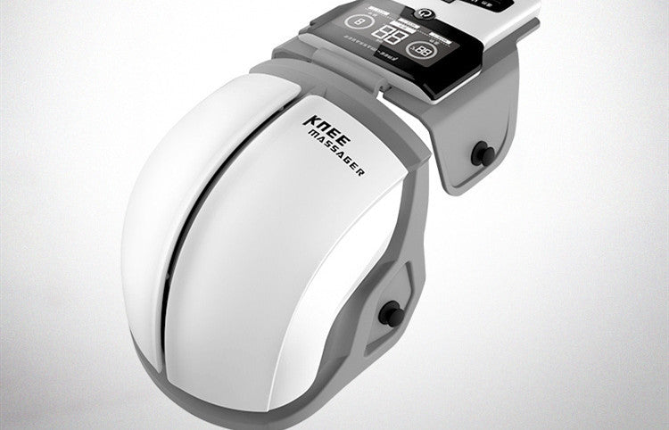 White handheld massager with digital display on a light gray background