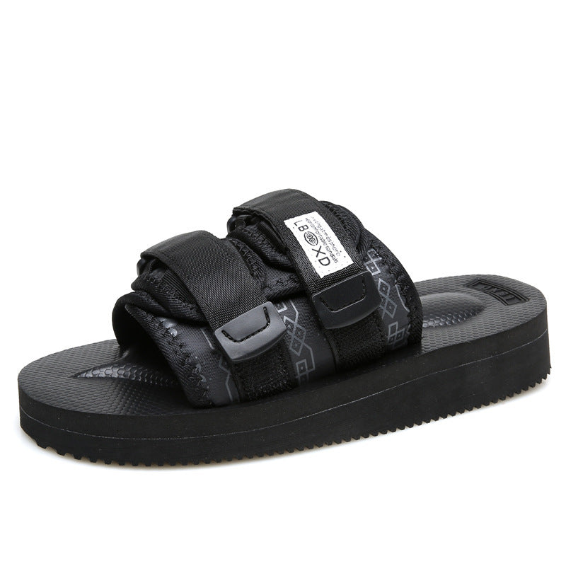 Black sandal with strap design on a white background
