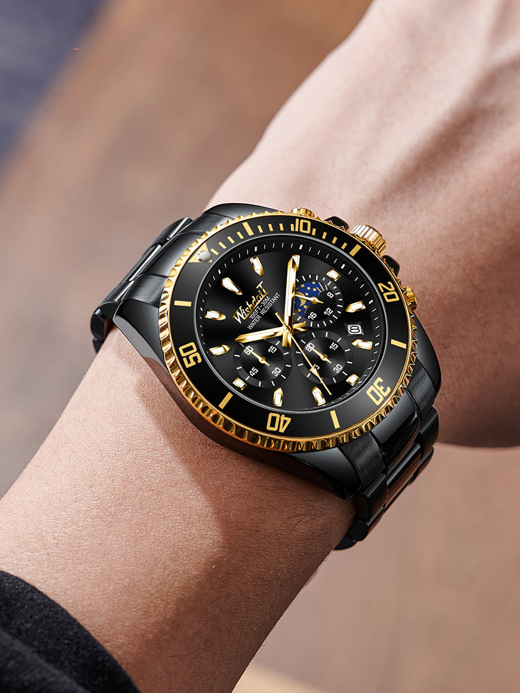Black and gold watch on a wrist with a blurred background