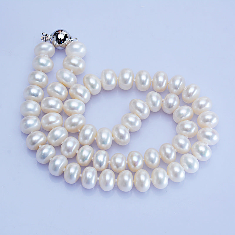 Pearl necklace on a light purple background