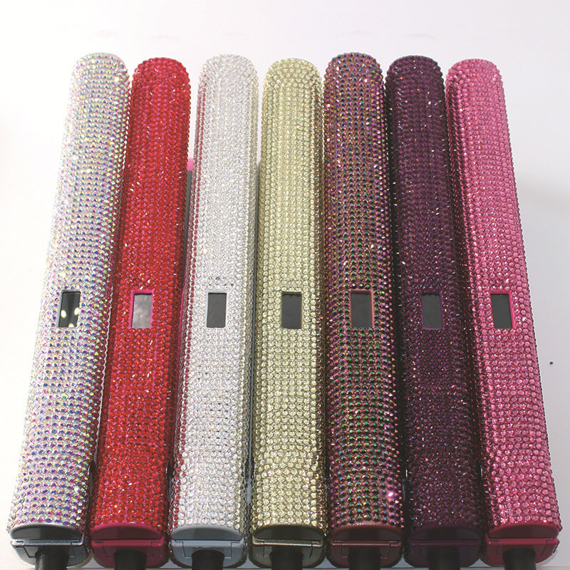 Set of rhinestone-handled objects in various colors on a white background
