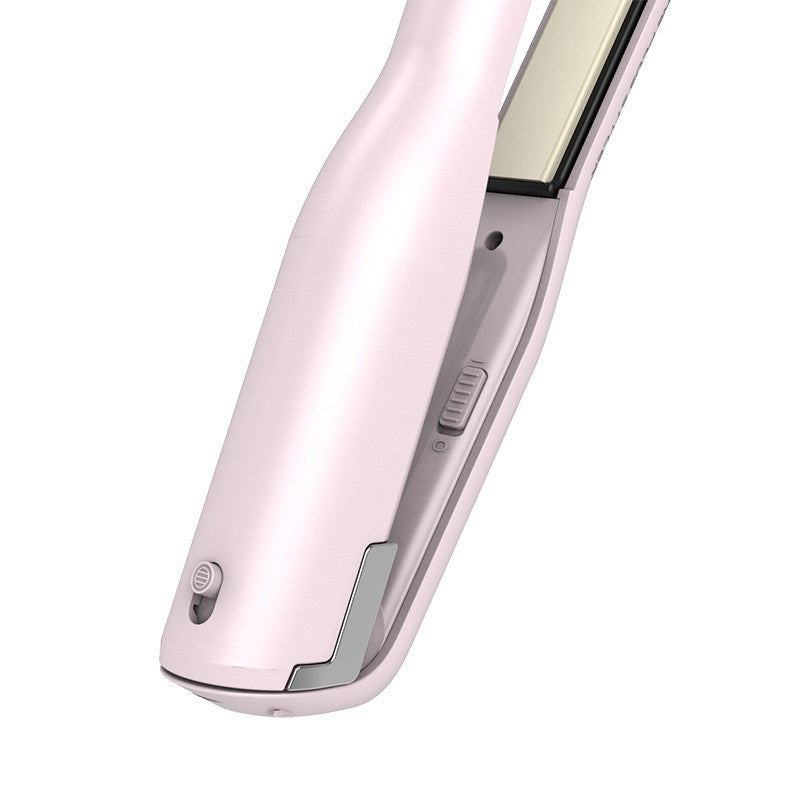 Close-up of a pink hair straightener on a white background