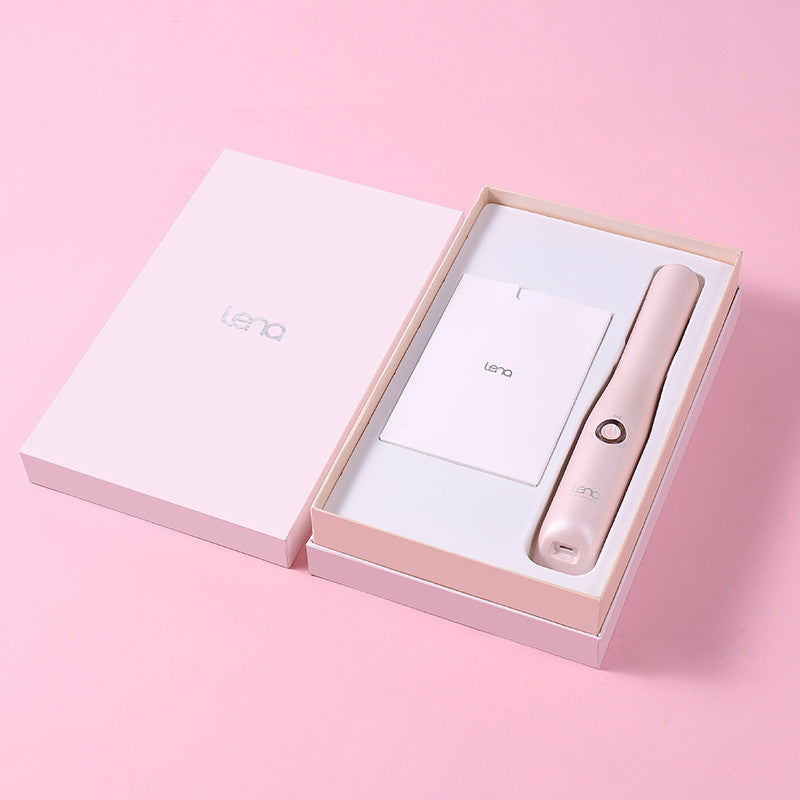 Pink electronic device in an open box on a pink background