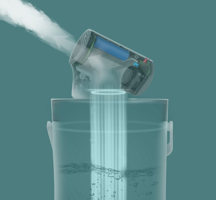 Steam being released from a handheld device into a clear container on a teal background