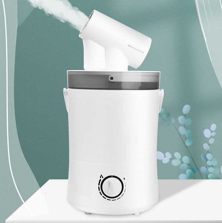 White handheld steamer emitting steam into a white container on a light green background.
