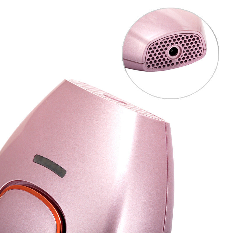 Pink hair dryer with close-up of nozzle on a white background