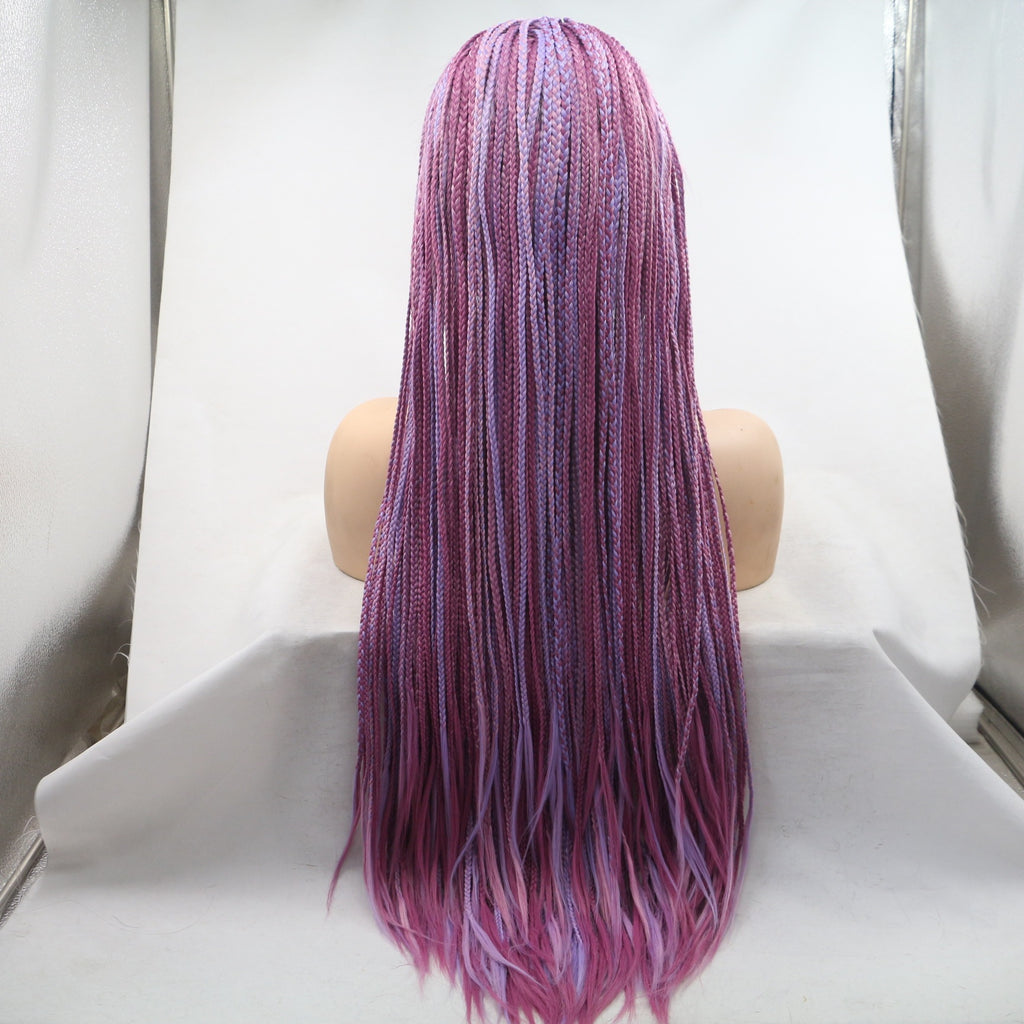 Mannequin head with a purple and pink braided wig on a white background